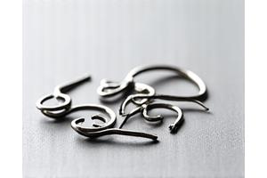 A variety of jig hooks with different bends and eye styles for lure making
